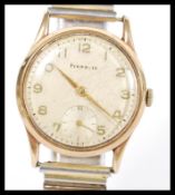 A vintage 20th Century Pinnacle wrist watch in a 9ct gold case having arabic numerals to the chapter