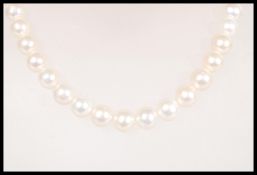 A vintage 20th Century freshwater pearl necklace having an 18ct gold magnetic clasp. Complete in