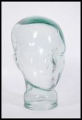 A vintage retro 20th century shop display / millinery mannequin head of pressed glass construction