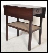 A 19th Century mahogany double drop leaf artists table, single frieze drawer with fitted swag