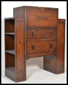 A 1930's Art Deco oak bureau. The central fall front bureau with appointed interior set over a