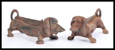 A pair of 20th century cast metal boot scrapers / door stops in the form of Dachshund dogs with