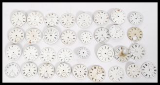 A selection of pocket watch faces of varying design, having white enamel finishing and some having