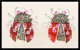 A pair of sterling silver and enamel cufflinks in the form of ladybirds having marcasite decoration.