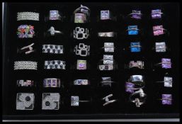 A collection of 36 contemporary designer sterling silver rings to include crossover, geometric,