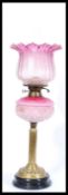 A Victorian brass and vaseline glass oil lamp. Brass neoclassical base and stem with two tone