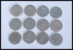 A collection of twelve / 12 commemorative £5 coins,all of different subjects with a face value of £