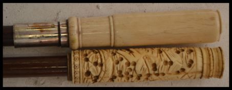 Two early 20th Century Edwardian  walking canes having tapering shafts, one with bone ring turned