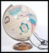 A mid century vintage / retro desk top globe with light up illumination inner having the globe being