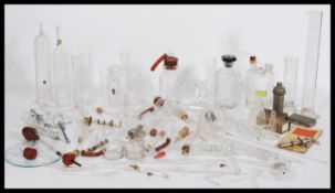 A collection of vintage 20th Century Scientific medical lab glass and instruments to include various