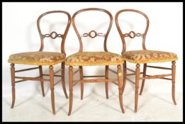A set of 3 Victorian mahogany faux bamboo aesthetic movement balloon back dining room chairs with