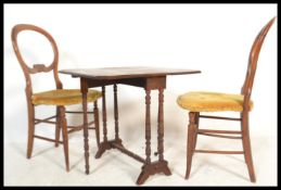 An Edwardian mahogany Sutherland table being raised on squared legs with drop leaves raised on