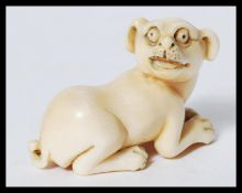 RARE MEIJI PERIOD IVORY CARVED NETSUKE OF A CROUCH