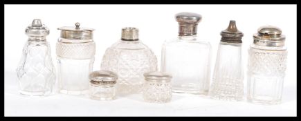A selection of cut glass and hallmarked silver cruet items to include a Henry Manton cruet (