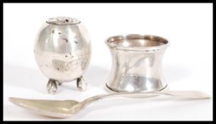 A group of three hallmarked silver items to include a Georgian silver fiddle pattern spoon, tapering