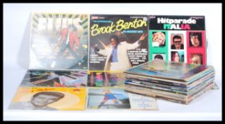 A collection of vinyl long play LP records featuring various artists to include Rick Nelson, Jerry