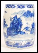 An early 20th century large Chinese ceramic stool of barrel shape having hand painted decoration