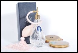 A Stuart cut glass crystal atomiser etched with floral detailing in its original box with two
