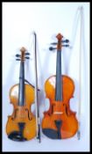 Two 20th Century violins to include a Skylark Cantonese violin with a dark wood and horsehair bow