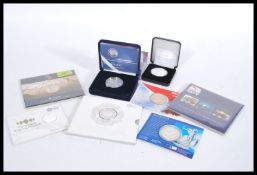 A collection of silver proof commemorative coins to include a Royal Navy £5 Commemorative Coin (