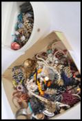 A collection of vintage costume jewellery to include various necklaces, beads, bangles, bracelets