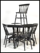 A Victorian 19th century large ebonised mahogany octagonal dining table with turned legs united with