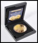 2013 The HRH Prince George Five Crown Coin, 65mm layed 24 carat coin,with two Swarovski ruby