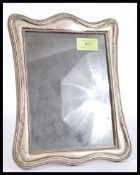 An early 20th century silver hallmarked easel photograph frame bearing marks to lower corner. The