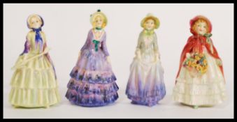 A group of four Royal Doulton figures to include HN1447 Marigold, HN1445 Biddy, HN1444 Pauline and