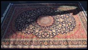 A Persian Islamic blue ground Keshan rug with flor