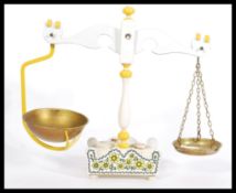 A pair of vintage retro 20th Century Taunton Vale white painted wood kitchen balance scales having a