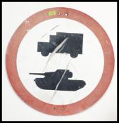 A vintage 1960's road sign from Salisbury Plain warning of tanks and military trucks crossing.
