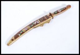 A 20th Century Chinese miniature sword / paper knife in a wooden and brass sheath with floral