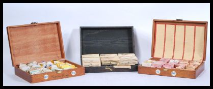 Three wooden cases of vintage 20th Century perspex / acrylic watch glasses of varying sizes to
