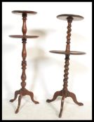 A Victorian mahogany barleytwist dumb waiter with twin circular tiers being raised on splayed feet