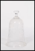 A 19th century Regency acid etched bell cloche with knop top and all over decoration. Measures