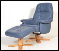 A Stressless style blue leather reclining armchair and matching ottoman raised on a faux wood base