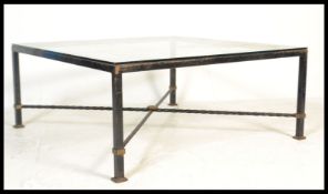 A vintage retro 20th Century cast metal coffee table of large square form having a large glass top
