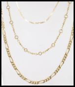 A hallmarked 9ct gold flat necklace chain having a spring ring clasp, along with two other yellow