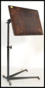 A stunning early 20th Century Edwardian cast metal reading lectern , the stained adjustable pine top