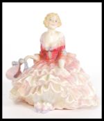 A vintage early 20th Century Royal Doulton ceramic figurine entitled Tildy, HN1575. Stamped to base.