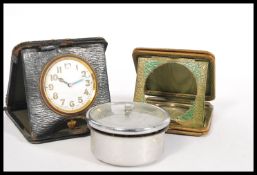 Two vintage 20th Century leather pocket watch travelling cases one being green leather and the other