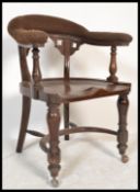 A 19th century Victorian Industrial factory managers desk chair. Raised on turned legs with later