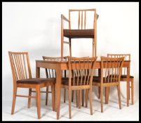 A mid century Cotswold School walnut  dining room suite by Arthur Reynolds of Ludlow to include