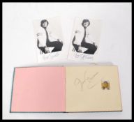 A vintage autograph book having signatures from a selection of mid 20th Century entertainment