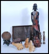 A selection of treen items to include to carved tree roots in the form of monkeys and another in the