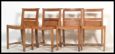 A set of 4 mid 20th century Air Ministry / War Department style beech wood chapel chairs. Squared
