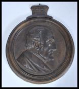 A mid 19th Century Victorian gilt bronze plaque depicting the bust of The Duke of Wellington in