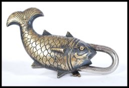 A 20th Century bronzed padlock in the form of a swimming koy karp fish with decorative keys.