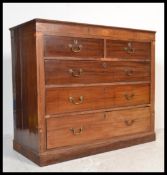 A Regency 19th century Scottish mahogany inlaid chest of drawers being raised on a plinth base